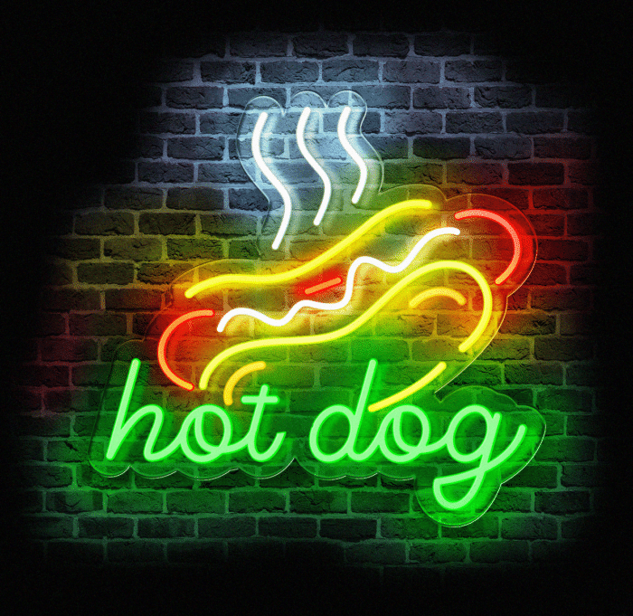 Neon LED w kształcie hot doga na tle ceglanej ściany