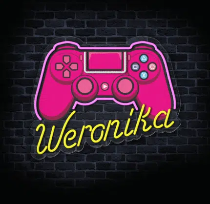 Neonowy znak LED z padem do gier w pokoju gracza.